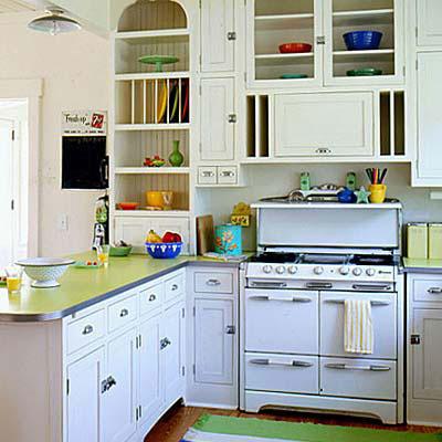بلد kitchen with a white wood cabinets and silver door handles