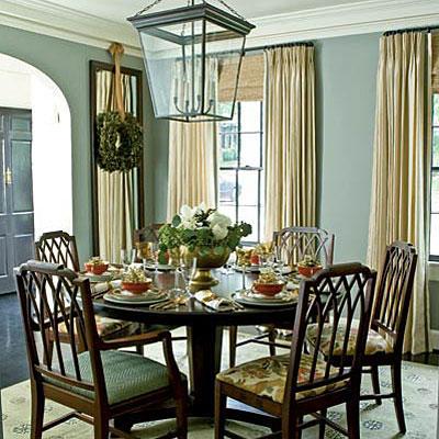 Блед, steel gray walls in the dining room with floor to ceiling cream shades (and a round dining room table and chairs)