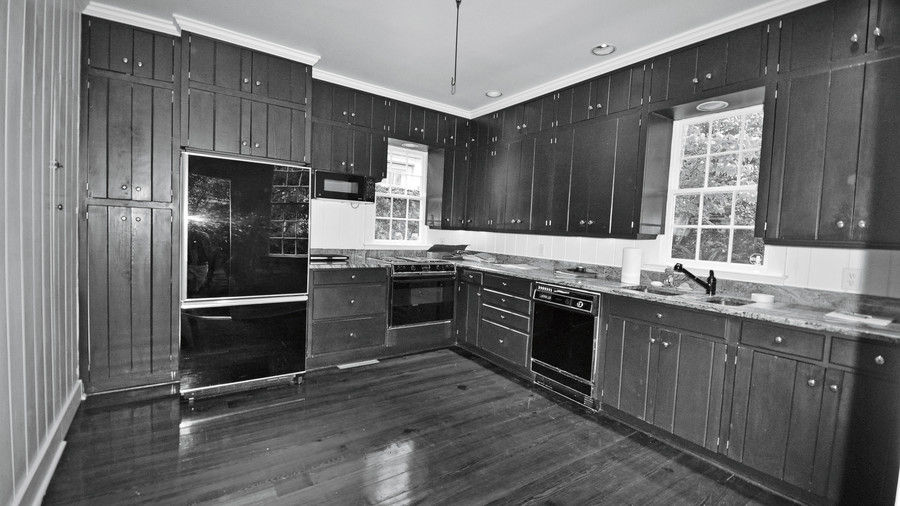 Anticuado Farmhouse Kitchen with Wood Cabinets