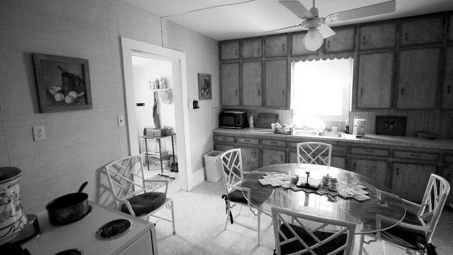 Anticuado Kitchen with Cabinets and Glass Table