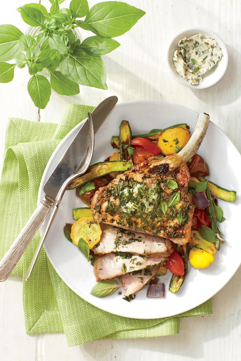 A la parrilla Pork Chops with Basil Butter and Summer Squash