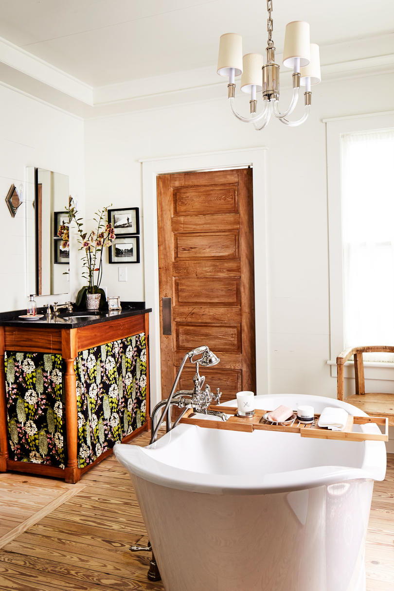 Ginny Stimpson's Fairhope Bay House Master Bathroom with centered soaker tub