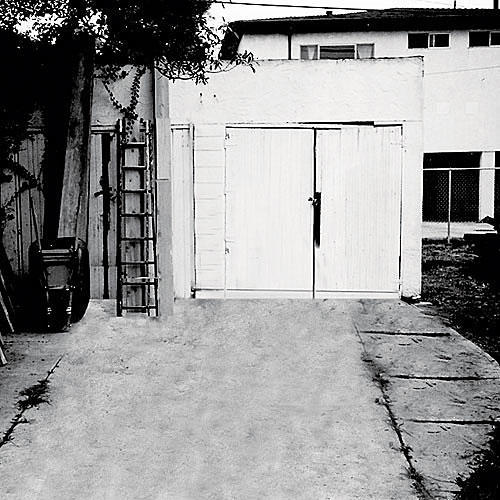قديم، freestanding garage with a set of white doors