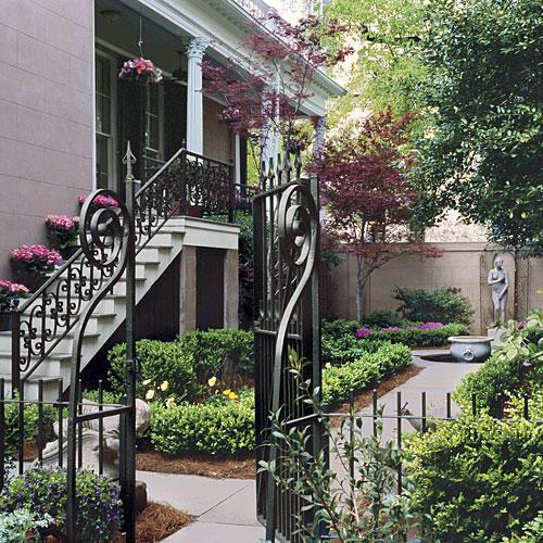 Savannah courtyard garden with walkway and statuary