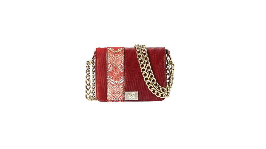 ако being trendy won you touchdowns, we’d want this bag on our team. We can’t get enough of the fiery red embossed suede or the snakeskin details. (P.s. This one was inspired by the designer’s time at Ole Miss. Hotty Toddy, indeed.)