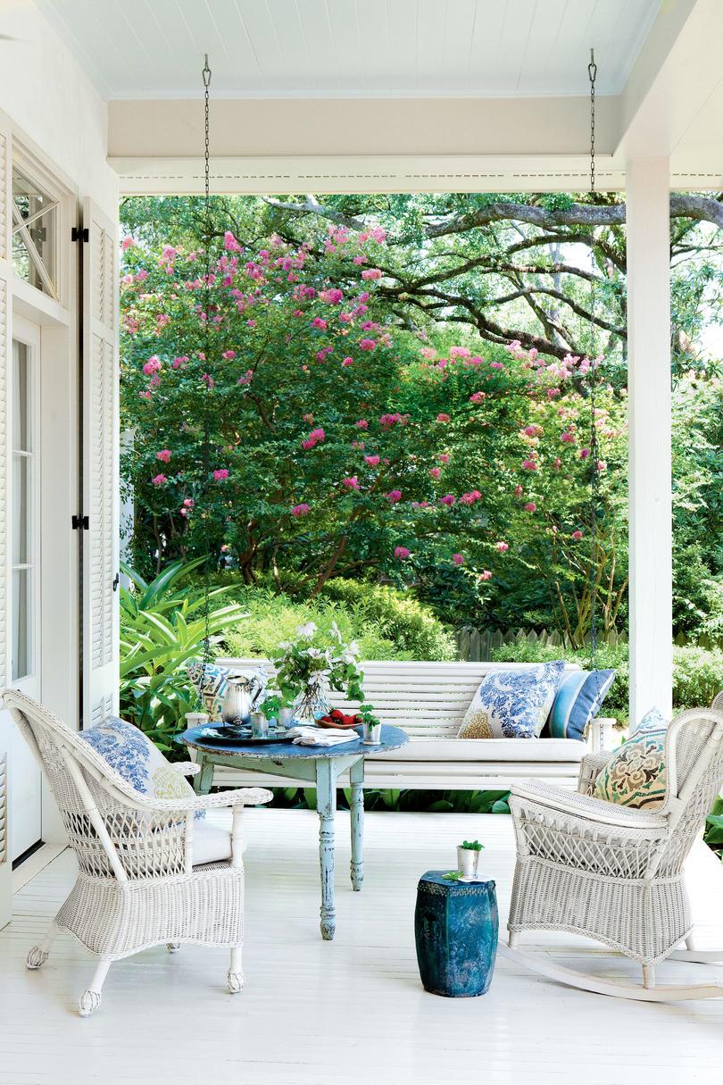Azul and White Porch with Wicker Chairs and Swing