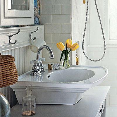 مرتفع white sink with a steel faucet and beaded board walls in a renovated bathroom project