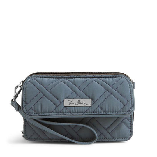 Това quilted purse works overtime: You can wear it as a wristlet or over your shoulder. 