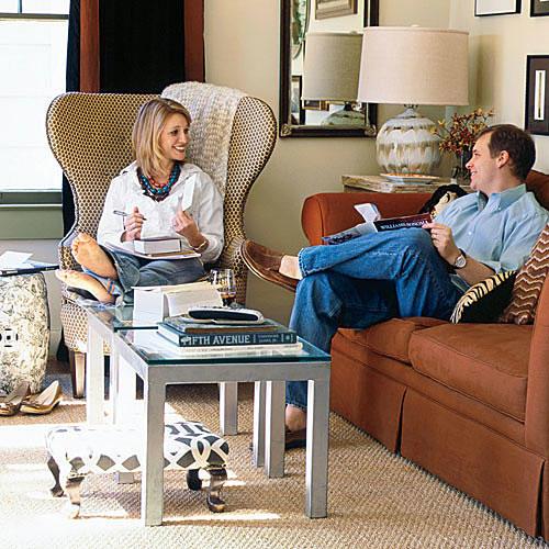 ウィング chair re-covered in tan-dotted fabric and lined with dark brown lining set into a living room with classic styling